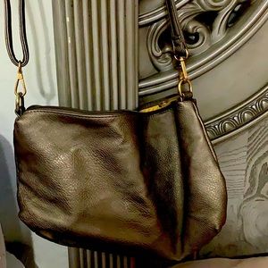 Hi this is a Michael kors bag it was in my closet and it was a new know so wante